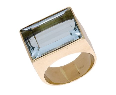 An aquamarine dress ring, the step-cut aquamarine bezel-set to a tapered 18ct gold band, London hallmark, ring size I-J.   £6