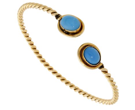 A turquoise torc bangle, of ropetwist form, the terminals inset with oval turquoise cabochons, inner diameter 6.5cm.  £500-£7