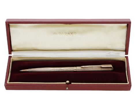 A 9ct gold propelling pencil by Parker, engine-turned decoration, initialled ‘G P R’ and dated ‘3 6 81’, Sheffield 1979, case