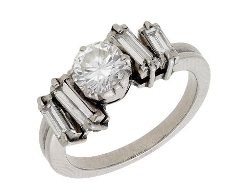 A diamond ring, the central brilliant-cut diamond set between staggered baguette-cut diamonds, principal diamond approximatel