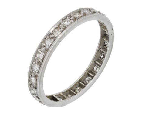 A diamond eternity ring, set throughout with single-cut diamonds, total diamond weight approximately 0.70 carat, ring size M.