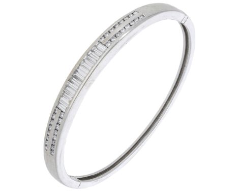 A diamond bangle, channel-set to the front with brilliant and baguette-cut diamonds, total diamond weight approximately 2.00 