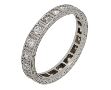 A diamond eternity ring, set throughout with old brilliant-cut diamonds, engraved decoration to the band, total diamond weigh