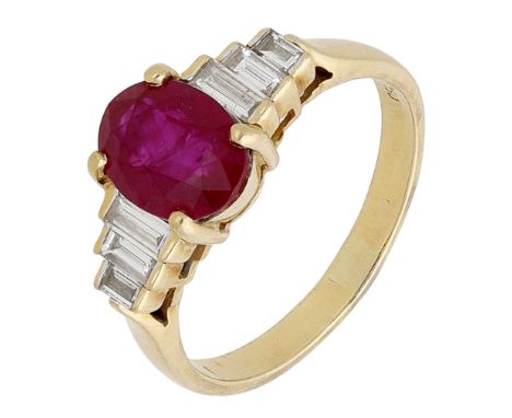 A ruby and diamond ring, the oval mixed-cut ruby set between stepped shoulders of baguette-cut diamonds, stamped ‘750’, ring 