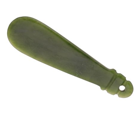 A New Zealand greenstone hand club/patu (mere pounamu), of flat teardrop-shape, with drilled suspension hole, length 10.4cm. 