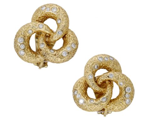 A pair of diamond ear clips by Vourakis, of stylised trefoil design, with textured finish and set with brilliant-cut diamonds
