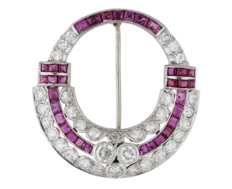 An Art Deco ruby and diamond brooch, circa 1930, the open circlet set throughout with transitional-cut diamonds and with step
