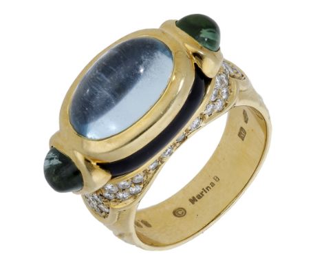 A gem-set ring by Marina B, set with an oval blue topaz cabochon with green gemstone cabochons to either side, with polished 