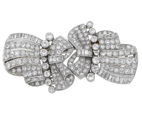 An Art Deco diamond double-clip brooch, circa 1930, of pierced ribbon design, set throughout with baguette, brilliant and sin