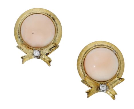 A pair of coral and diamond ear clips, each cabochon above a brilliant-cut diamond set bow, with textured finish, stamped ‘14