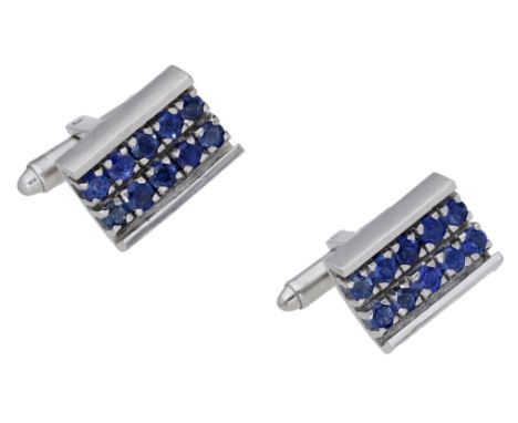 A pair of sapphire cufflinks, the rectangular panels set throughout with circular-cut sapphires within polished borders, T-ba
