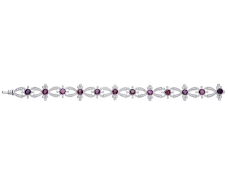 A ruby and diamond bracelet, set with circular-cut rubies in alternating cluster and trefoil surrounds set with brilliant-cut