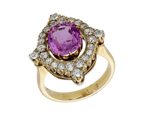 A pink sapphire and diamond ring, converted from an antique pendant, the oval-cut pink sapphire, weighing 3.21 carats, in a c