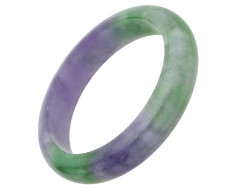 A jade bangle, the polished bangle suffused with mottled lilac and green, (jade untested), inner diameter 6cm.  £100-£200  --