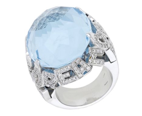 A blue topaz and diamond ‘Amore’ dress ring by Pasquale Bruni, the oval fancy-cut blue topaz in an openwork mount reading ‘Am