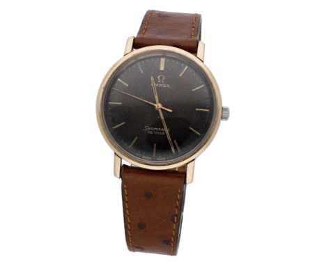 Omega. A gold plated wristwatch, Seamaster De Ville, circa 1960. Movement: manual winding. Dial: black, applied baton indexes