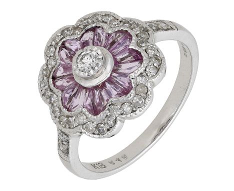 A pink sapphire and diamond dress ring, of flowerhead design, set with brilliant-cut diamonds and calibré-cut pink sapphires,
