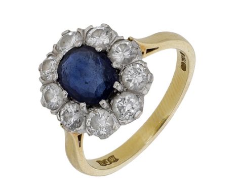 An 18ct gold sapphire and diamond cluster ring, the oval mixed-cut sapphire claw-set within a surround of brilliant-cut diamo