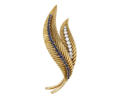 A gem-set leaf brooch, circa 1960, the leaves with reeded detailing and set with circular-cut sapphires and brilliant-cut dia