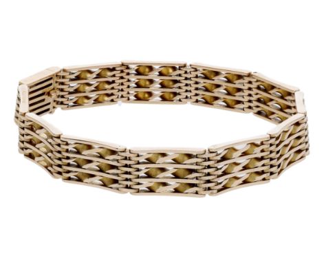An early 20th century gold gate-link bracelet, with openwork spiral detailing, stamped ‘15’, length 18.5cm. £500-£700  ---  C