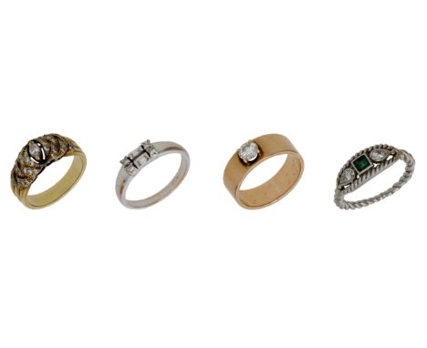 Four diamond rings, set with vari-cut diamonds, one additionally set with a square-cut emerald, total diamond weight approxim