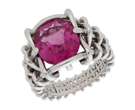 A pink tourmaline dress ring by Verdura, the oval-cut pink tourmaline to a tapered woven wirework mount, signed ‘VEDURA’ and 
