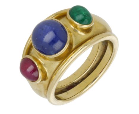 A gem-set ring, 1987, of tapered bombé style, set to the front with a sapphire, ruby and emerald cabochon, mounted in 18ct go