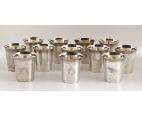 A set of 12 silver sporting beakers, the tapered stacking beakers each engraved with a game bird or animal, individually numb