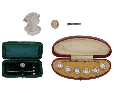 A small collection of jewellery, comprising two shell cameos, a diamond bar brooch, two diamond stickpins, and a cased set of
