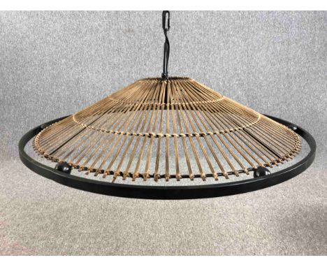 Kindred Lighting. The Mambo natural rattan ceiling pendant. Rattan with a metal surround and suspended with a ceiling chain. 