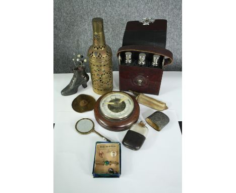 A miscellany of nine items including a cased set of three glass bottles, a German Veranderlich barometer, two pairs of cuffli