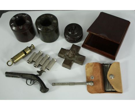 A miscellany. Includes a vintage pitch pipe tuner, brass whistle, a bakelite light switch, a matching pair of bakelite ashtra