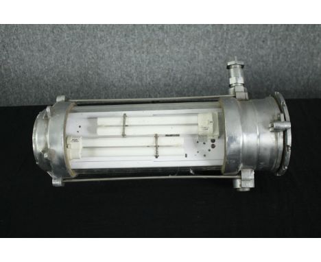 A mid century industrial aluminium and tubular glass wall light with fluorescent bulb. Originating from East Germany. Restore