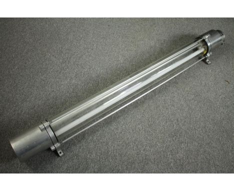 A large mid century industrial ceiling light from East Berlin. Aluminium and tubular glass fitting a fluorescent strip bulb. 
