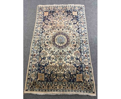 Carpet, Ispahan, silk mix with central medallion on a biscuit field within scrolling multiple borders. L.200 W.118cm. 