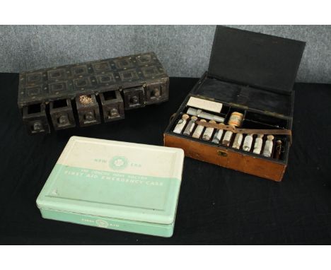 An African hardwood set of trinket drawers with stud detailing along with a vintage first aid kit and an early 20th century l