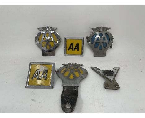 A pair of spot lamps, other lamps, Rubbolite lamps, boxed, three vintage vehicle prints, and a group of petrol can caps (box)