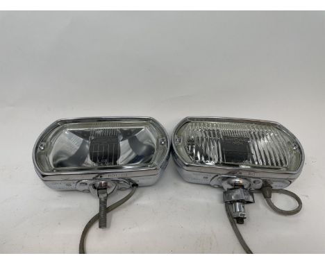A pair of Lucas Quartz-Halogen driving lamps, with covers, a Cibie driving lamp, with a cover, and a BP Shell-Mex petrol can 