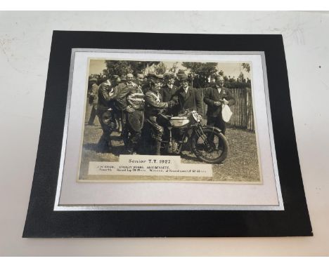 A monochrome photograph, Senior TT 1927 (J W Shaw, Stanley Woods & Alec Bennett), 15.5 x 21 cm, mounted, two John Bull TT Rac