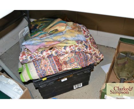 A box of various textiles 