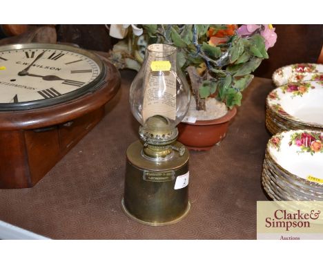 A brass oil lamp by J.W.Searby &amp; Son Lowestoft