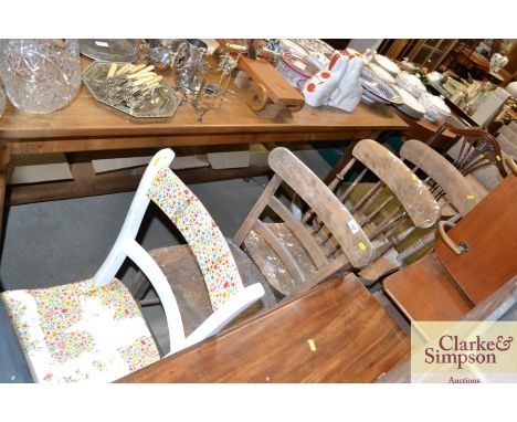 A pair of elm seated stick back kitchen chairs, two others and a mahogany Hepplewhite style dining chair
