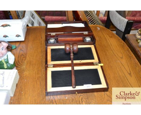 A writing slope together with a gavel