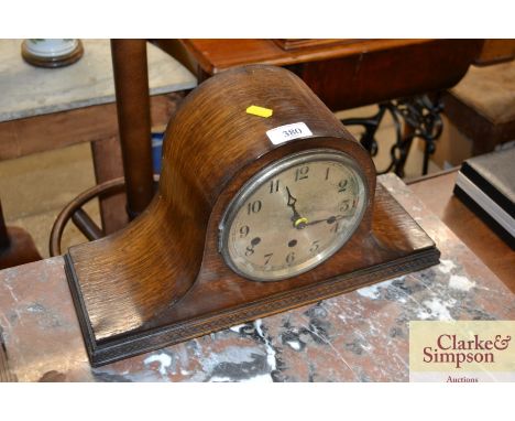 An oak cased three hole mantle clock 
