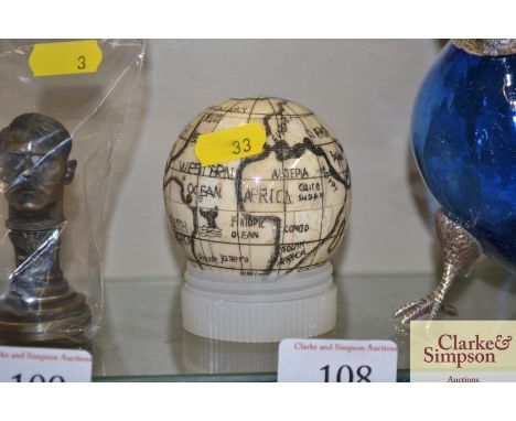 A bone globe compass 