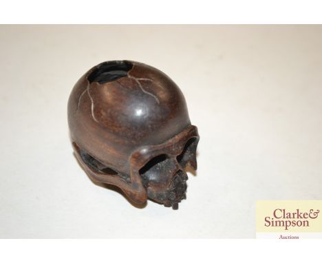 A Japanese wooden skull Netsuke