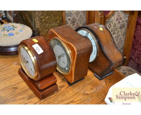 A Woodford mantle clock together with a Smiths two hole Art Deco mantle clock and one other Smiths three hole mantle clock
