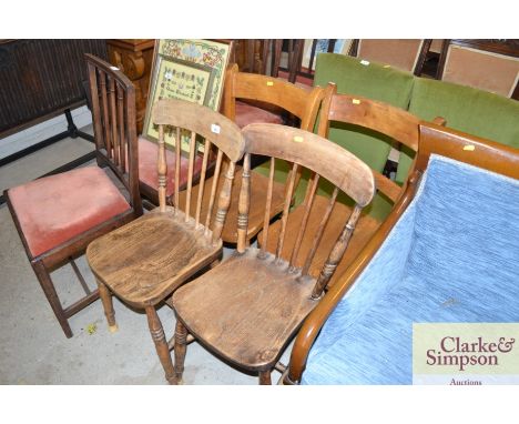 A pair of Victorian elm seated stick back kitchen chairs and a pair of similar bar back kitchen chairs