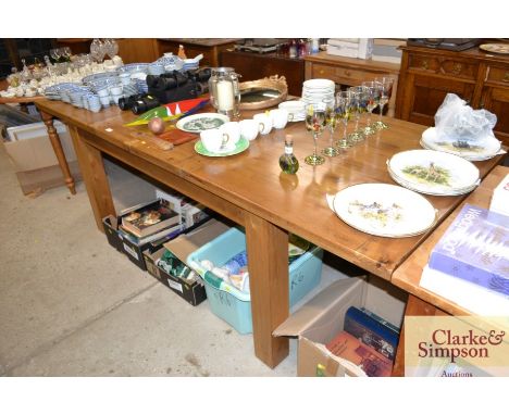 A good quality light oak extending dining table