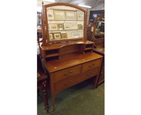 Early 20th century mahogany dressing table, with shaped and bevelled rectangular mirror on tapering square section supports, 